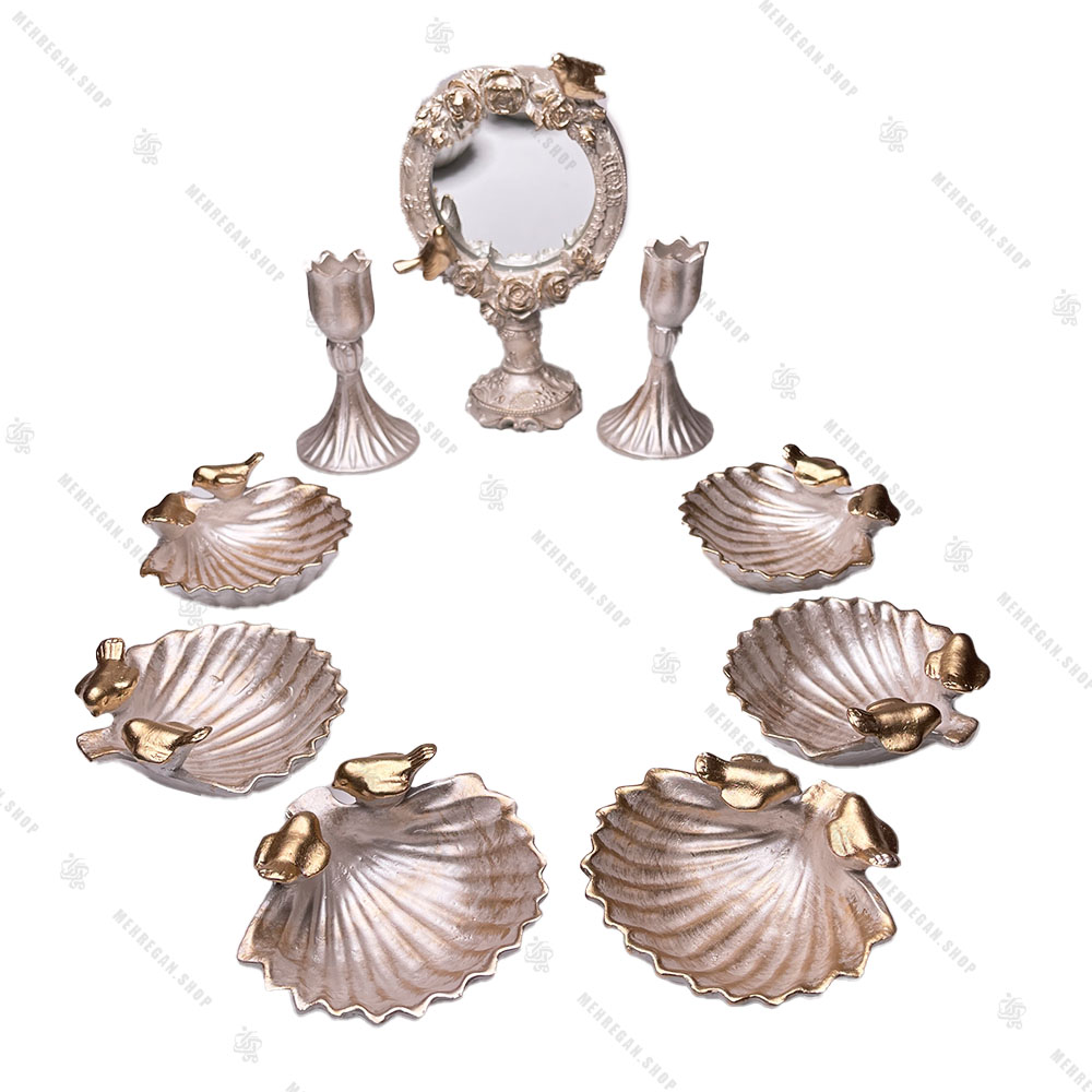مجموعه ظروف هفت سین 9 پارچه طرح صدف مجموعه ظروف هفت سین 9 پارچه طرح صدف